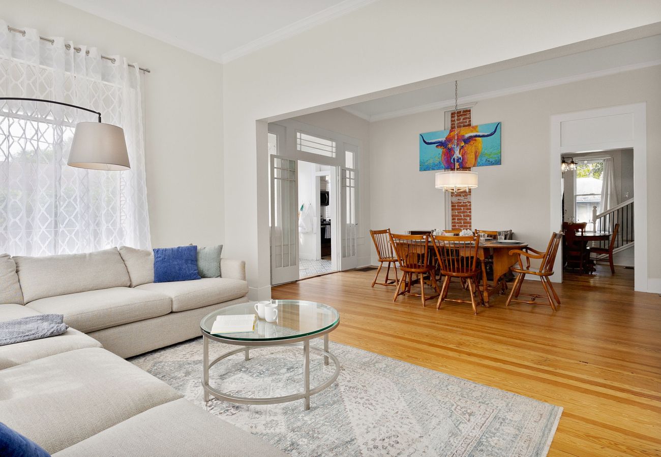 open concept, French doors, exposed brick, historic home Bright Sitting Room w/ Sectional | Historic Seguin Home