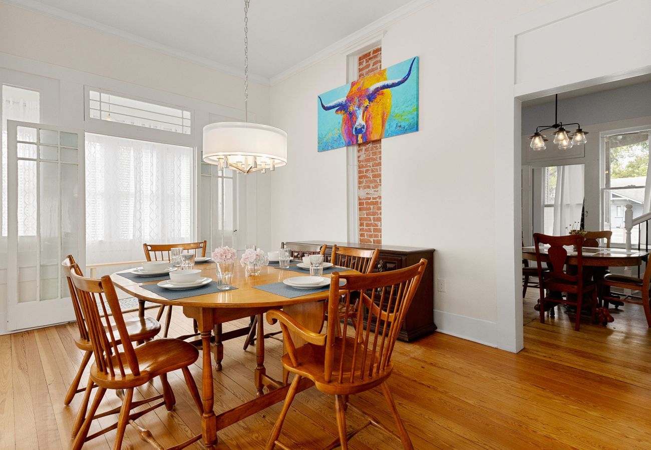 living dining combo, open dining room, French doors, transom windows Bright Living–Dining w/ French Doors | Historic Seguin Home