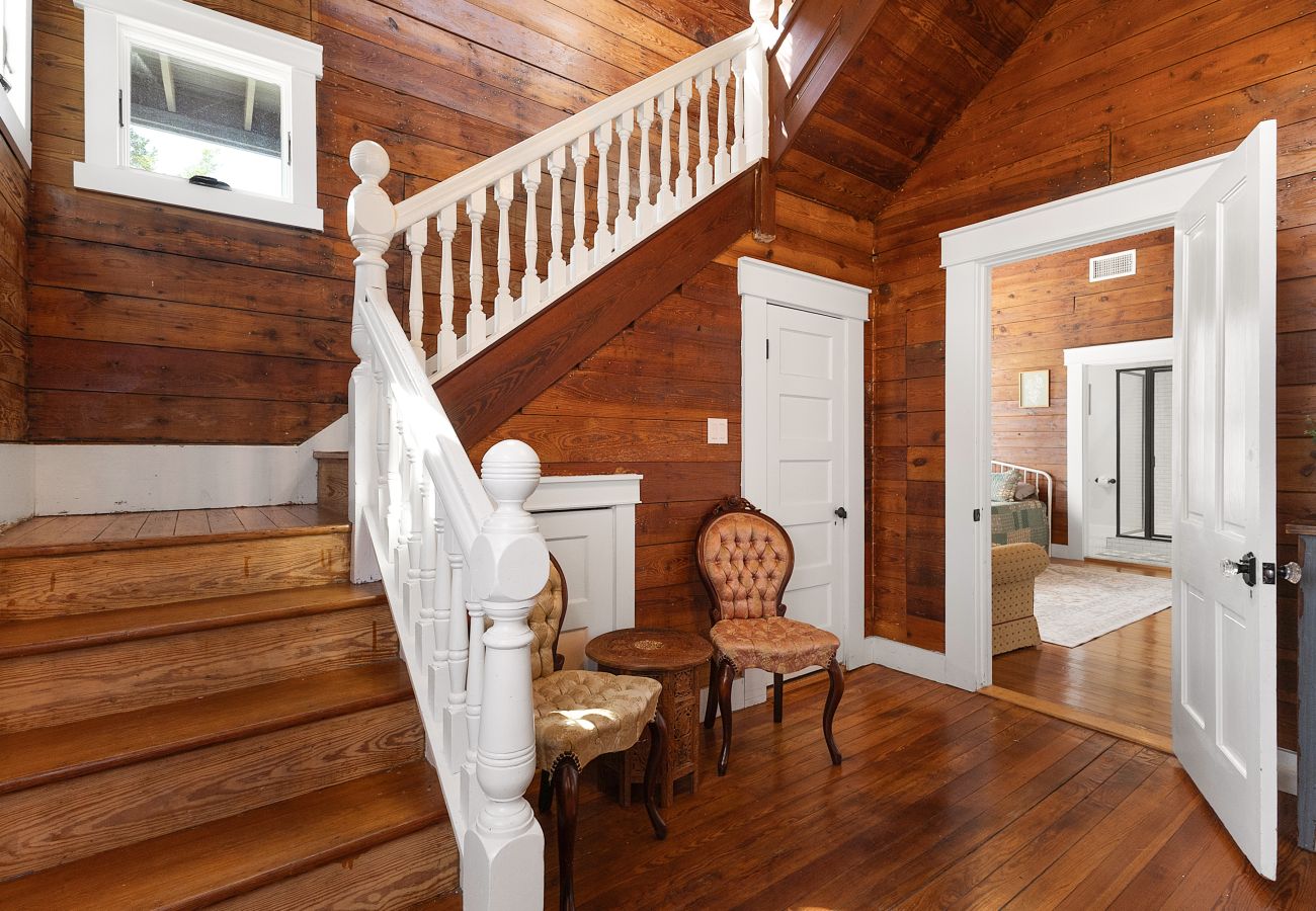 communal spaces, piano, balcony, and vintage ambiance with modern ease